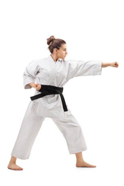 istock Karate girl punching 905970728