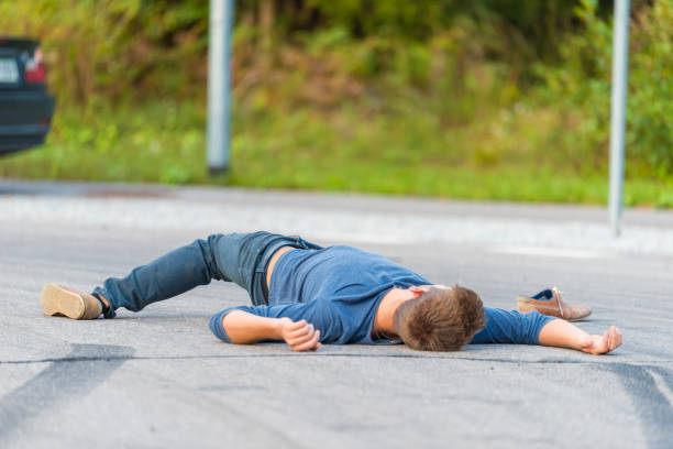 istock Traffic accident.Young man hit by a car 905971084