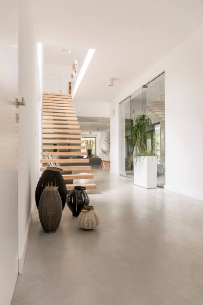 Spacious loft with decorative lanterns Designed wooden stairs in spacious white loft with decorative lanterns from travel landing home interior stock pictures, royalty-free photos & images