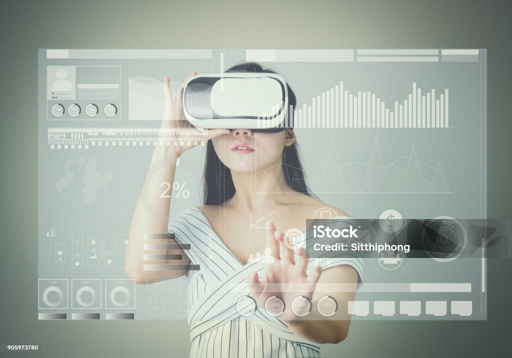 woman wore a virtual reality headset that simulates, And touch screen technology graph. the reality and looked up to see what the virtual reality was capable of rendering. Graph Stock Photo