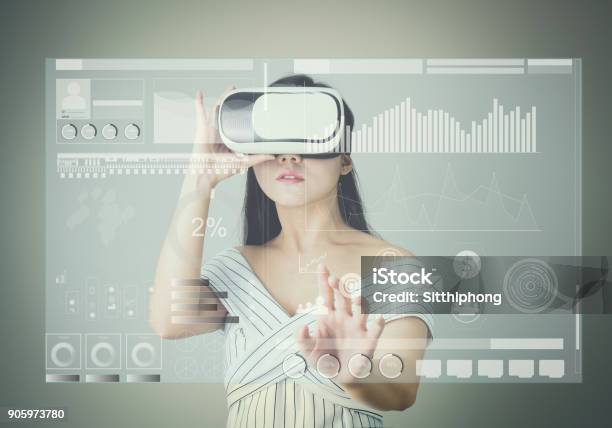 Woman Wore A Virtual Reality Headset That Simulates And Touch Screen Technology Graph The Reality And Looked Up To See What The Virtual Reality Was Capable Of Rendering Stock Photo - Download Image Now