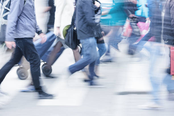 istock Diversified motion blurred crowd crossing street 905974020