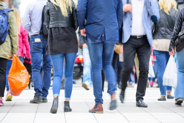 istock Diversified motion blurred crowd crossing street 905974154