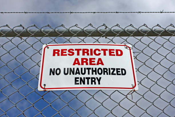 istock Restricted Area Sign On Security Fence 905974418