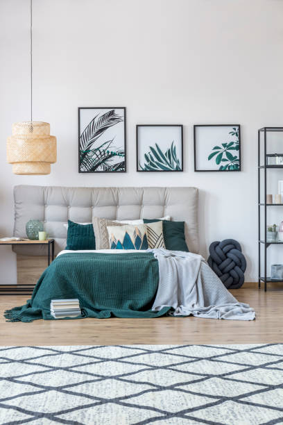 istock Green and grey bedroom interior 905974622