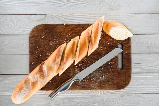 istock sliced baguette and knife 905974712