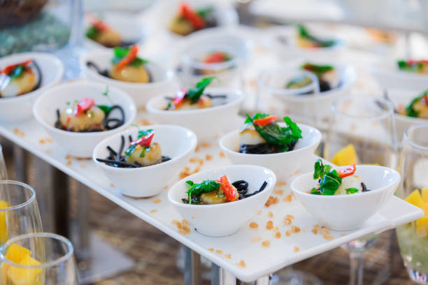 istock Scallop cocktail on black spaghetti line in white cup 905978016