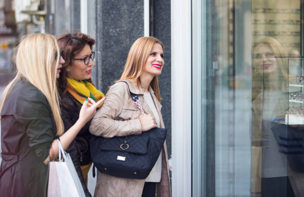 istock Beautiful women in shopping 905978956