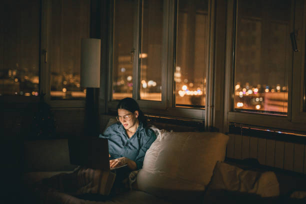 istock Woman using laptop at home 905982488