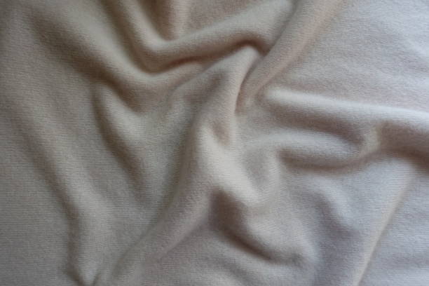 istock Crumpled simple white fluffy woolen knitted fabric 905983456