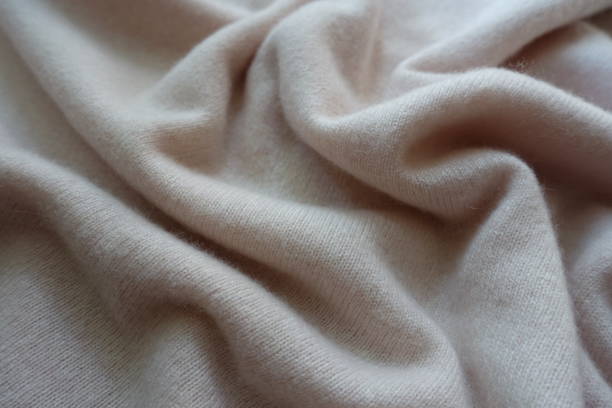 istock Rumpled simple white fluffy woolen knitted fabric 905983476
