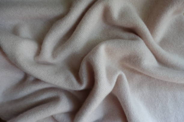 istock Rippled simple white fluffy woolen knitted fabric 905983490