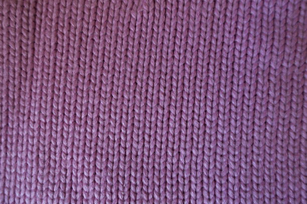 istock Handmade pink plain knit stitch fabric from above 905983728