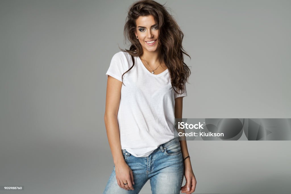 Beautiful woman Smiling female model isolated on grey background Women Stock Photo