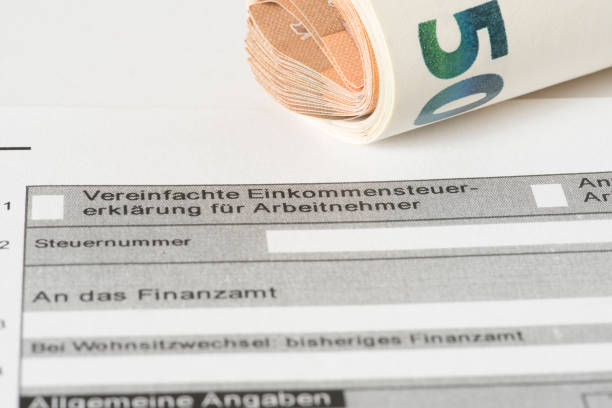 istock A form for a tax return and euro banknotes 905989510