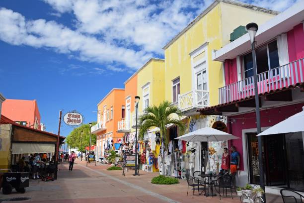 Street with stores in San Miguel de Cozumel San Miguel de Cozumel, Mexico - 9th January, 2018: Street with stores in the center of San Miguel de Cozumel. The San Miguel de Cozumel is the largest city in Cozumel Municipality in the Mexican state of Quintana Roo. san miguel de cozumel stock pictures, royalty-free photos & images