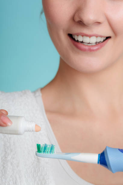 istock Young girl with toothpaste and toothbrush. 905996486