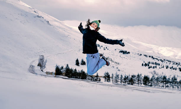 istock Cheerful woman jumping in the mountains 905996530
