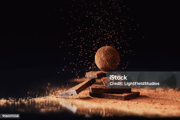 Close Up View Of Tasty Truffles On Black Stock Photo - Download Image Now - Chocolate, Chocolate Truffle, Gourmet