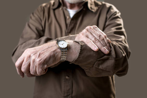 istock Pensioner showing his wristlet watch 906006320
