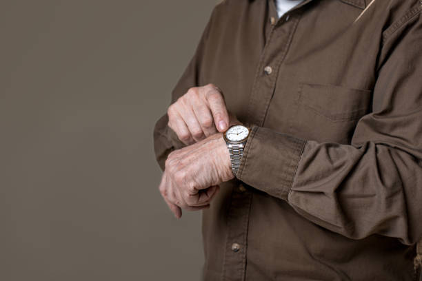 istock Old male arm with watch 906006550