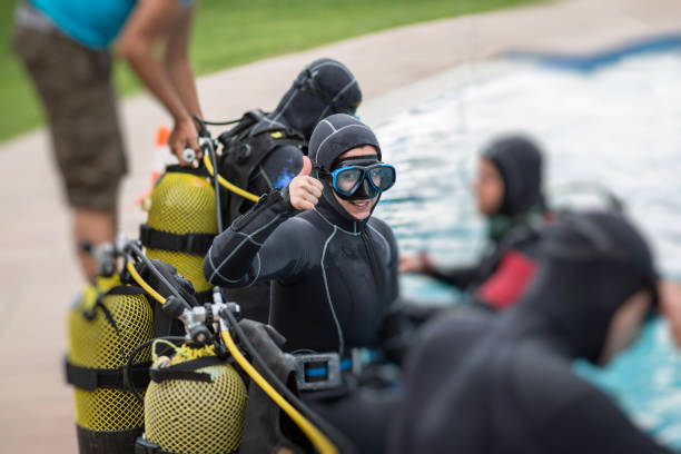 Cheerful diver gesturing thumb up stock photo