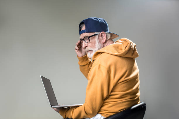 thoughtful male person using device - using laptop contemplation accessibility contemporary imagens e fotografias de stock