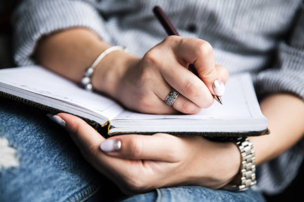 istock Notebook or sketchbook in hands. Creativity, art and education concept. Toned image 906016402