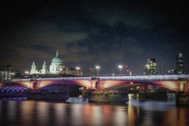 istock Blackfriars bridge at night with falling snow in London, UK. 906016406