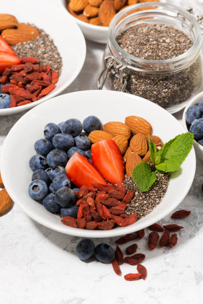 istock chia seeds, fresh berries and nuts for a healthy breakfast 906016602