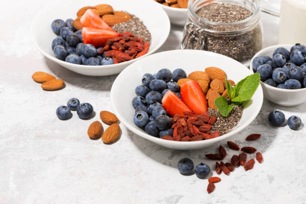 istock chia seeds, fresh berries and nuts for a healthy breakfast 906016848