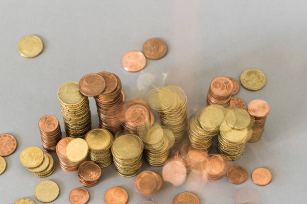 istock Pile of coins and falling money as template from above 906016932