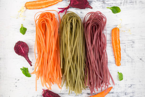 istock Colored Raw Vegetable Vegetarian Pasta. 906017360
