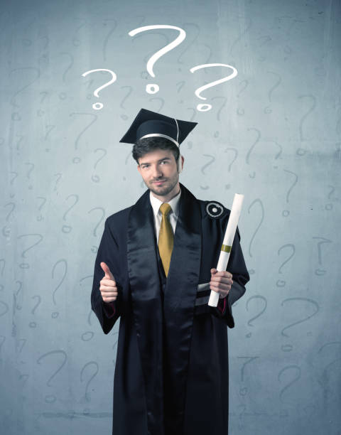 istock Young graduate teenager with question marks drawn 906017750