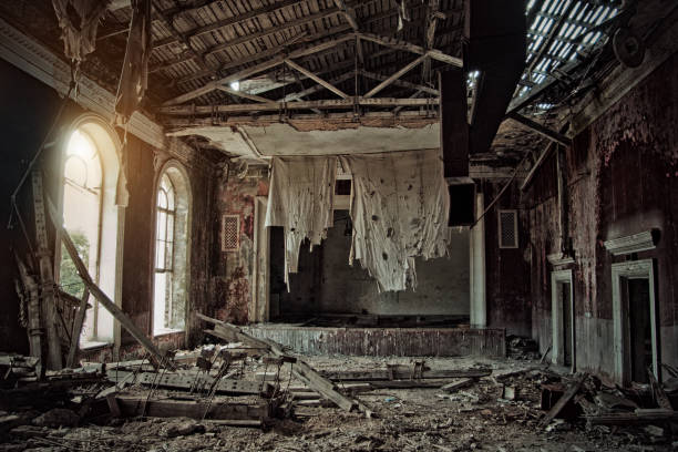 Old abandoned rotten ruined theater, a ragged curtain