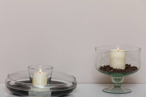 istock Decorative candles in bowls with coffee seeds 906021266