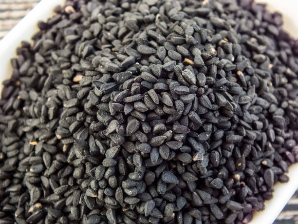 schwarz nigella samen - nigella sativa stock-fotos und bilder