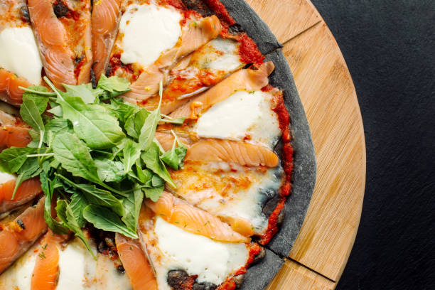 istock Pizza with Mozzarella, Salmon Slice and Vegetables 906022006