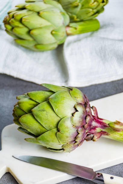 istock Green ripe raw artichokes ready to cook 906022574