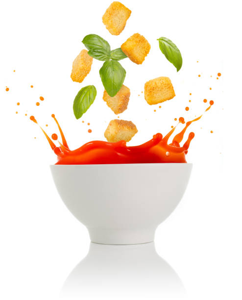 istock basil and croutons falling into a tomato soup bowl 906025752