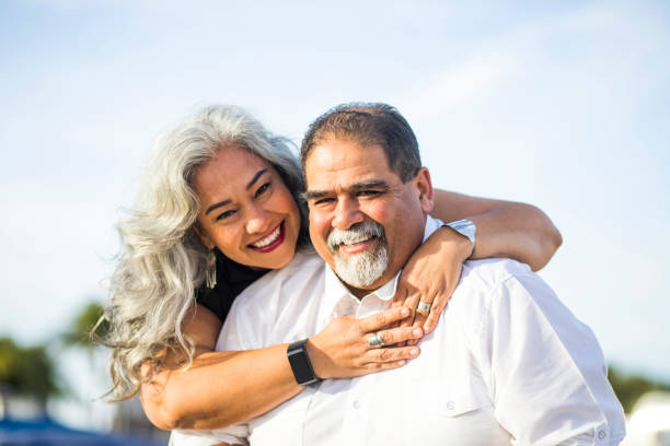 istock Senior Mexican Couple Piggyback at the Beach 906026850