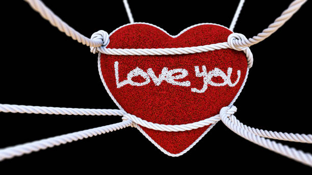 istock Suspended Cushion With Love Message Isolated On Black 906029950