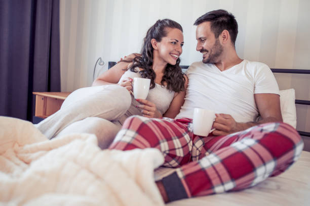 istock Loving couple lying on bed 906030020