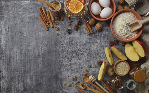 istock . Kitchen background with spices, utensils and natural ingredients for baking 906035562