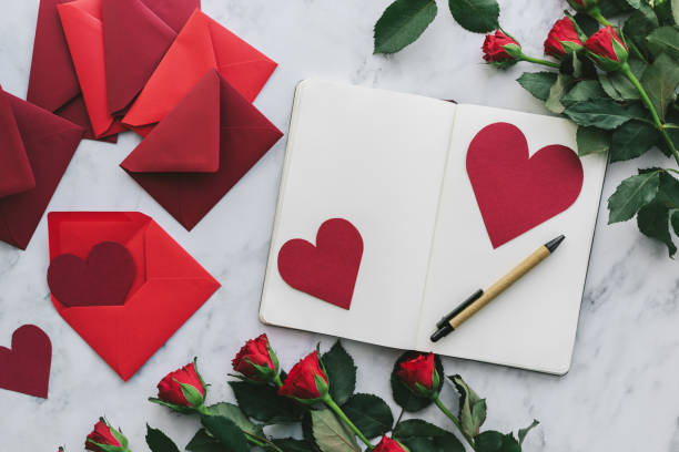 istock Valentine's Day cards with roses on a marble background 906035888