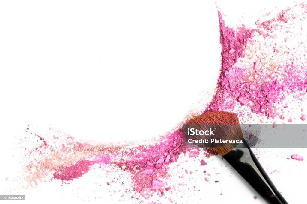 Powder and blush forming frame, with makeup brush Traces of vibrant pink powder and blush forming a frame, with a makeup brush. A square template for a makeup artist's business card or flyer design, with copy space Make-Up Stock Photo