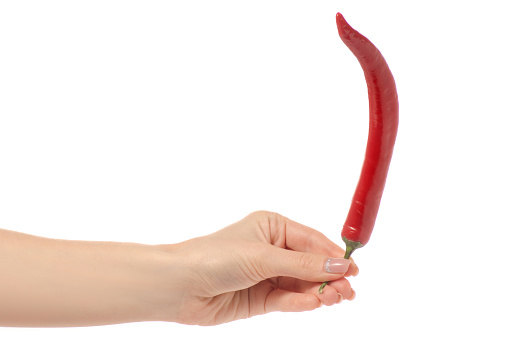 Red pepper in hand on white background isolation