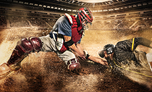 Sports, action and a man catching baseball, sliding in dust on floor with ball in baseball glove. Slide, dive and catch, baseball player on the ground during game, professional athlete on the field.