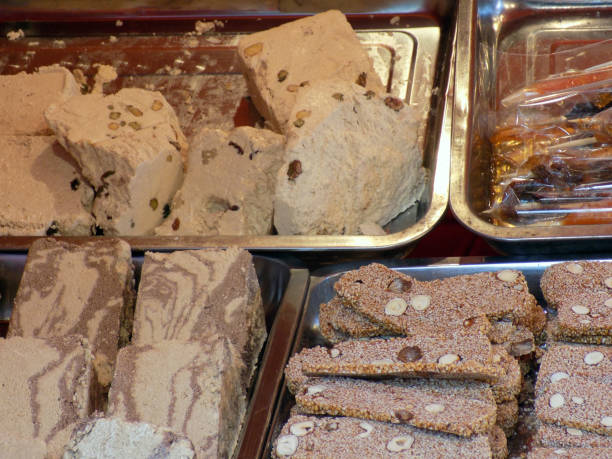 istock Crispy halvah cookies with various nuts and chocolate in the confectionery 906045432