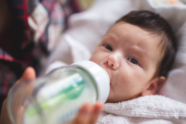 istock Little baby drinking milk 906045500